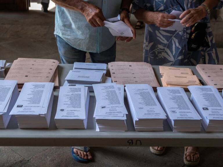 BARCELONA, SPAIN - 2023/07/23: Ballot papers are seen on a table. At 9:00 a.m. the polling stations opened to hold the general elections in Spain to elect the 350 deputies and 208 senators. (Photo by Paco Freire/SOPA Images/LightRocket via Getty Images)