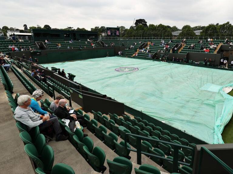 LONDON, ENGLAND - JUNE 29: A general view of court 3 as the covers protect the court from the rain during Day Two of The Championships - Wimbledon 2021 at All England Lawn Tennis and Croquet Club on June 29, 2021 in London, England. (Photo by Clive Brunskill/Getty Images)