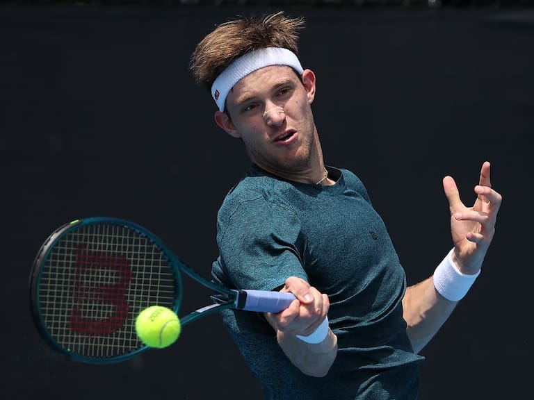 MELBOURNE, AUSTRALIA - JANUARY 15: Nicolas Jarry of Chile plays a forehand in their round one singles match against Flavio Cobolli of Italy during the 2024 Australian Open at Melbourne Park on January 15, 2024 in Melbourne, Australia. (Photo by Daniel Pockett/Getty Images)